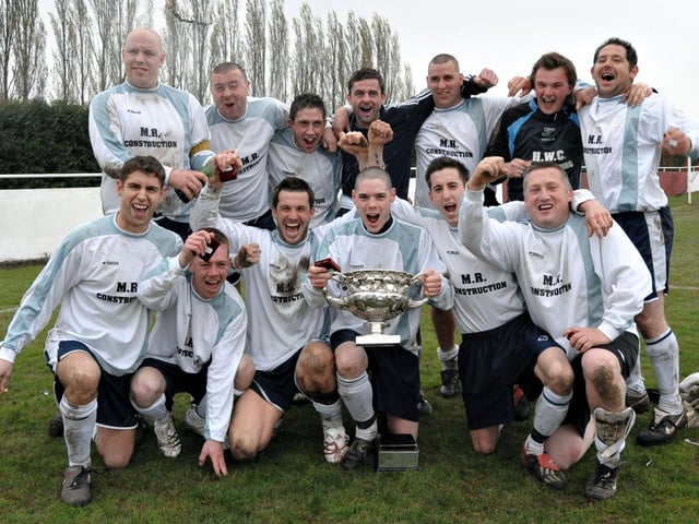 NBC Dragons celebrate their victory in the Father Purcell Cup at Cams Alders, 2006. Picture: Mick Young