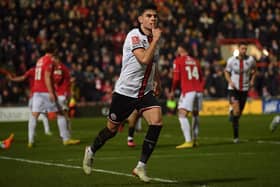 John Egan of Sheffield United celebrates his side's equaliser against Wrexham in the FA Cup: Gary Oakley / Sportimage