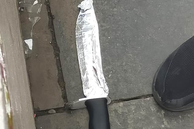 Strangely, the large bowie style knife was visibly wrapped in tinfoil.