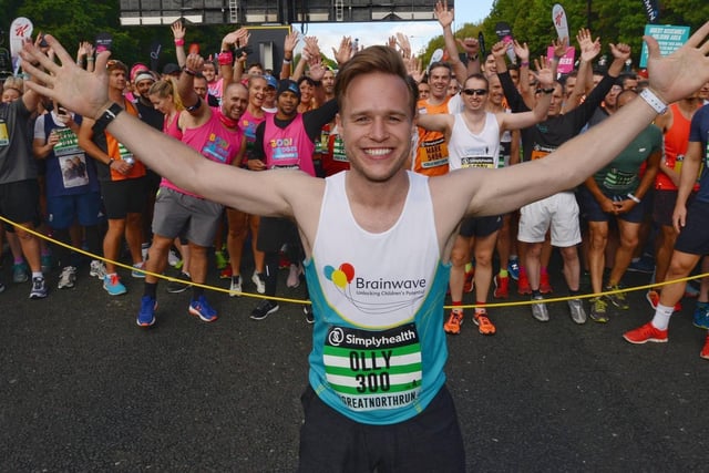 Singer Olly Murs poses for pictures before the start of the 2018 run.