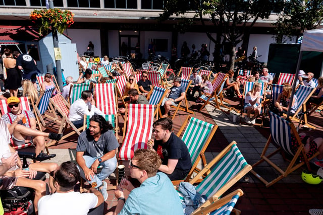 Southsea Food Festival 2019 at Palmerston Road, Southsea - Relaxing in the deck chairs. Picture: Vernon Nash 200719-016
