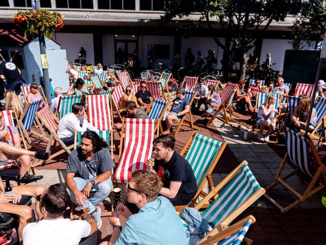 Southsea Food Festival 2019 at Palmerston Road, Southsea - Relaxing in the deck chairs. Picture: Vernon Nash 200719-016