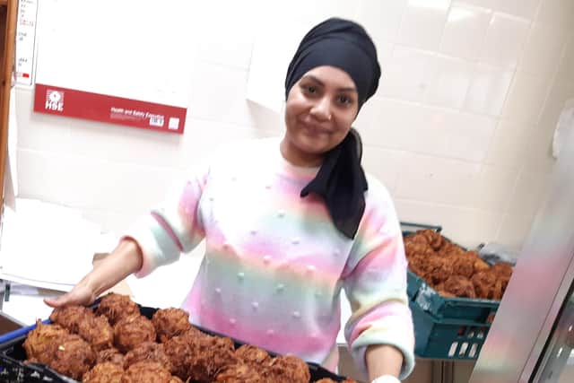 Dula Bibi, pictured with some of the onion bhajis produced in the kitchen at Beeches of Walkley, took over the store in April 2023