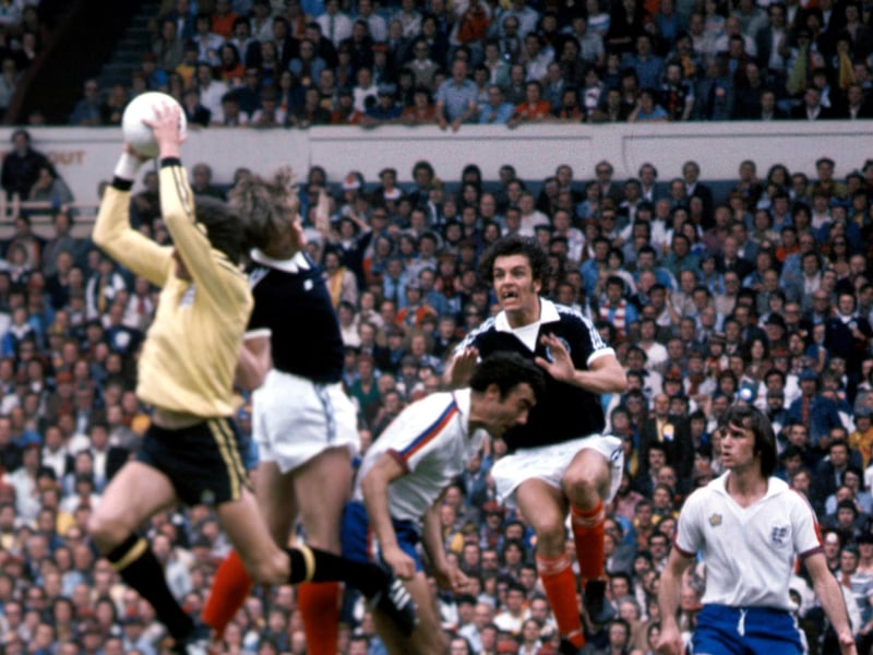 England goalkeeper Ray Clemence (left) reaches a cross before Gordon McQueen and Joe Jordan