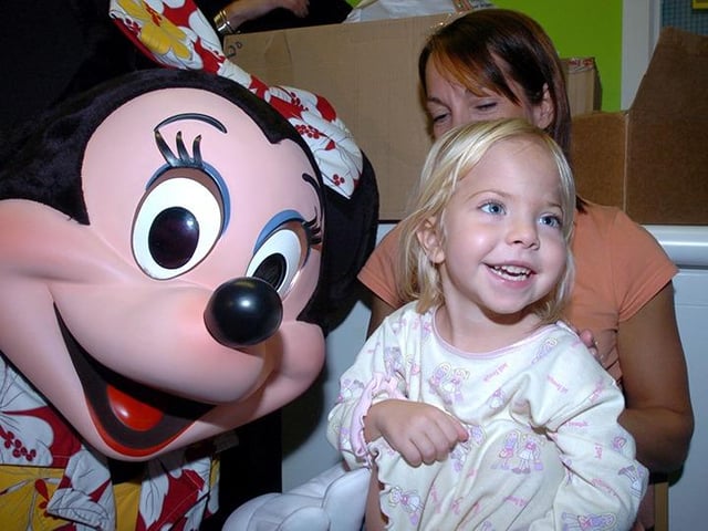 Pictured at the Sheffield Children's Hospital, where Disney's Mickey and Minnie Mouse visited children in the hospital. Seen is Minnie Mouse with three year old Phoebe Cannetti and her mum Jane, on November 8, 2005