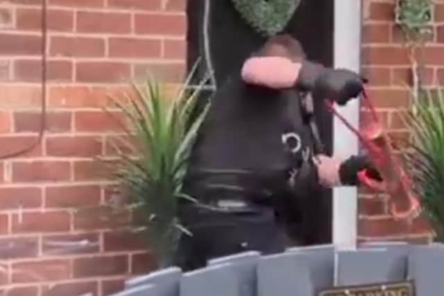 Picture shows police raiding a house on Manor Street, Carlton, Barnsley, in a raid as part of an inestigation into rural crime involving animal cruelty
