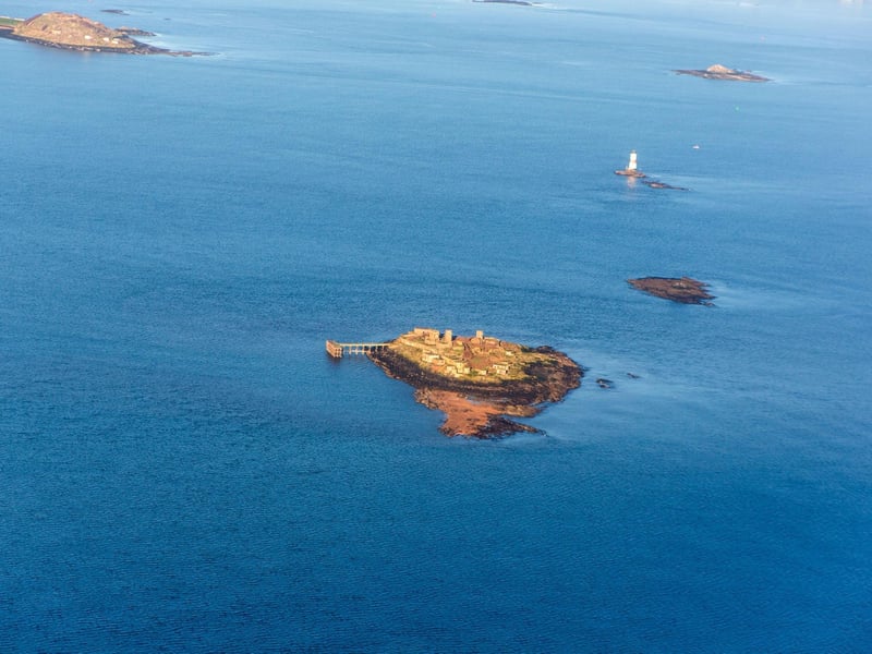 The tiny isle of Inchmickery sits squarely in the middle of the Firth of Forth, between Edinburgh and Fife. Its cluster of concrete, abandoned wartime buildings give it the look of a battleship from sea level, but it is now a peaceful haven for birdlife. It is the setting for the climax of Iain Banks' novel Complicity, and also features in the film adaptation.