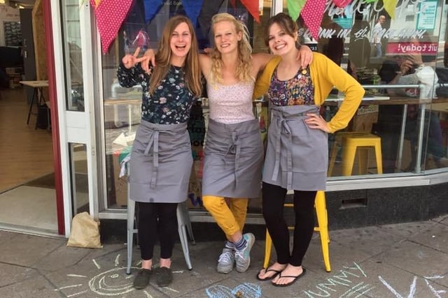 Big smiles outside a Sheffield vegan cafe in 2018
