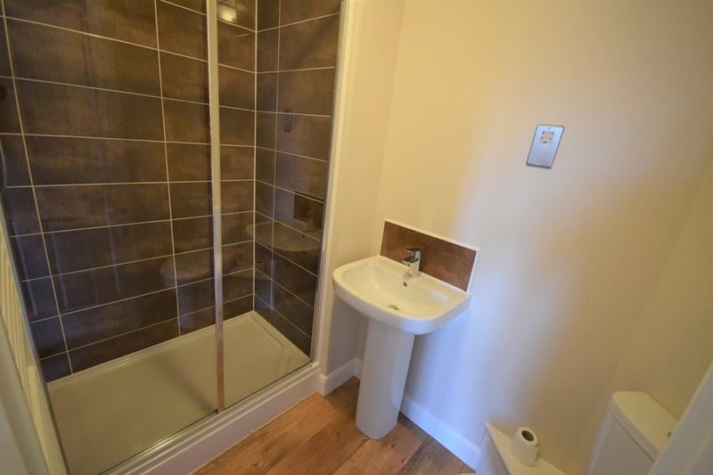 A high quality finish ensuite having new electric shower, cubicle and screen with contrasting wall tiles, wc, wash hand basin with chrome mixer tap, stainless steel shaver point, wall mounted towel rail and extractor fan.