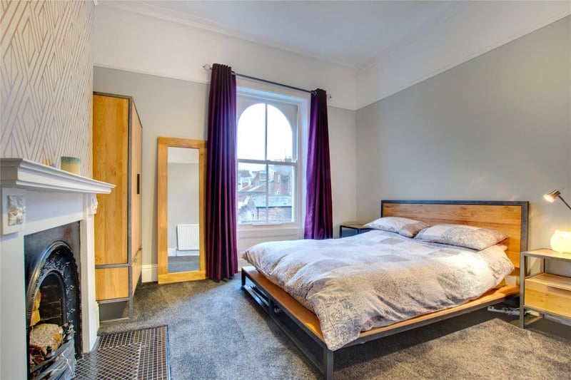One of the four bedrooms in the home. It features a decorative fireplace.

Photo: Rightmove