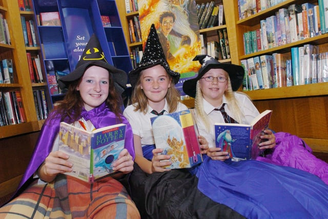 Harry potter fans, Holly White, harriet McAra and Abigail Ives-Owen get in a little light reading before their sleep over at Woodseats library ready to read the new Harry Potter book in 2005