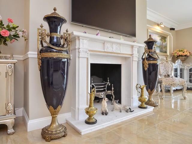 This huge five-bedroom Portsdown Hill home in Portsmouth is up for raffle. Here's a close-up the drawing room's fireplace.