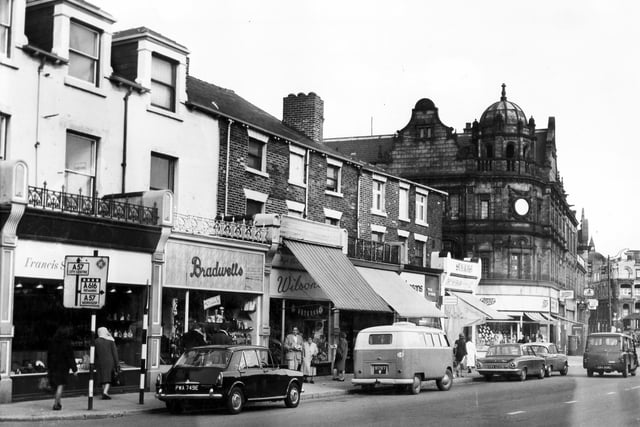 Shops on Glossop Road in 1967. Pictured are Bradwells, Francis Sinclair, Wilsons, Shaws and Boots the Chemist