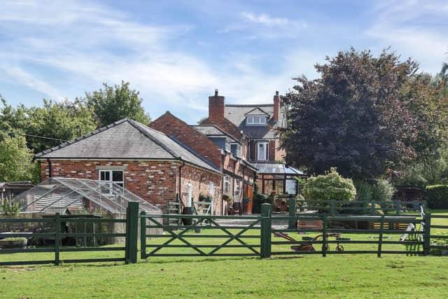 The Hollies on Park Lane, Kirkby, dates back to the early 1900’s has a range of outbuildings, annex and “beautiful grounds”.