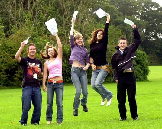 (left to right) Richard Noice (18), Jodi Poulter (18), Charlotte Jones (18), Vikki Farrer (18), and Lee Vaughan (18) celebrate their A-Level results at Fareham College. Picture: Malcolm Wells ( 000-0064 )
