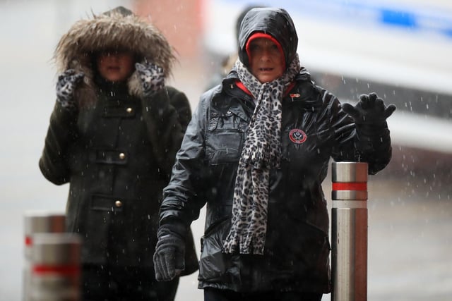 Fans arrive in the heavy rain for the Premier League match at Bramall Lane between Sheffield United and AFC Bournemouth