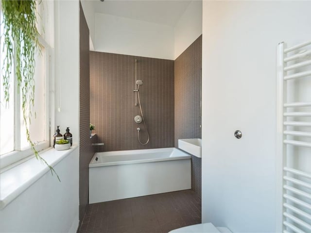 The main bathroom has a modern design.