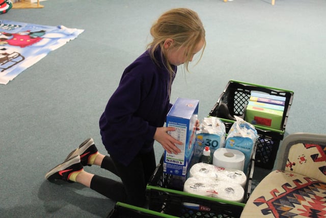 Children sorting donations for charity