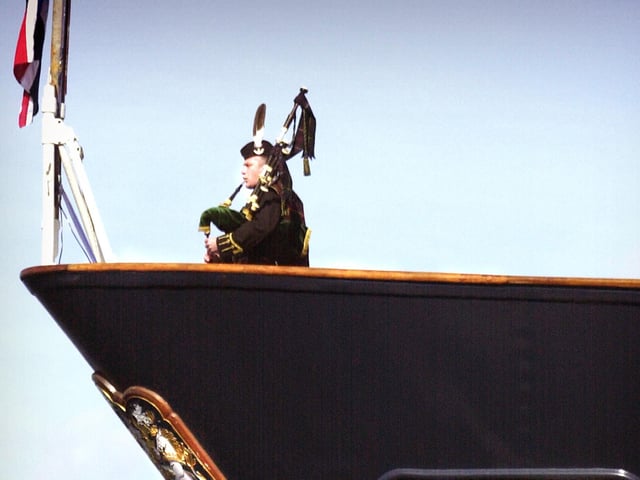 The piper is Jim Stout from Kirkwall.