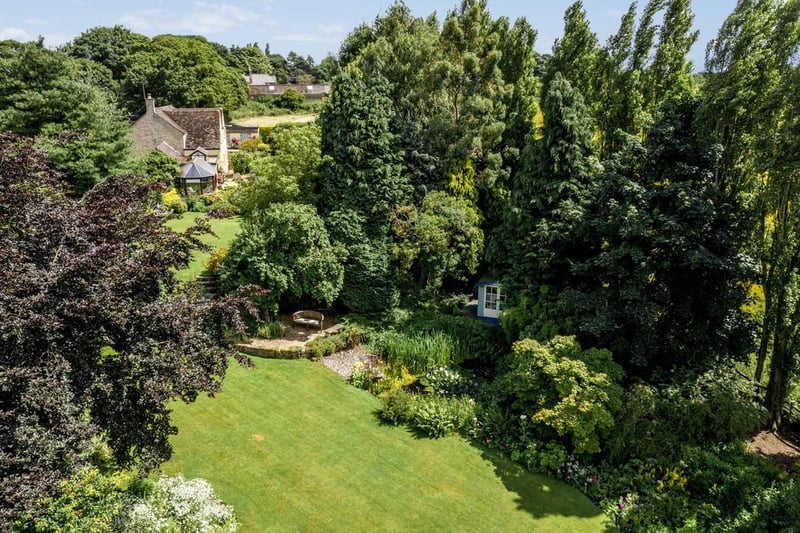 The property boasts fabulous landscaped grounds with stocked borders, lawn, pond and numerous seating areas.