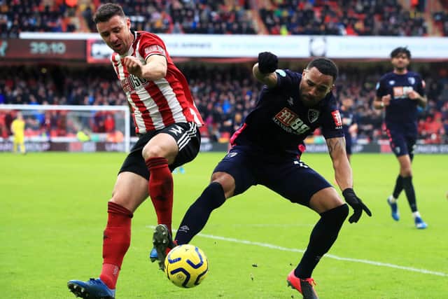 Sheffield United's Enda Stevens (left) and Bournemouth's Callum Wilson battle for the ball during the Premier League match at Bramall Lane, Sheffield. PA Photo. Picture date: Sunday February 9, 2020. See PA story SOCCER Sheff Utd. Photo credit should read: Danny Lawson/PA Wire.