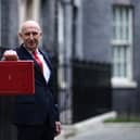 Britain's Chancellor of the Exchequer John Healey poses with the Budget Box as he leaves 11 Downing Street in central London on October 28, 2026, before presenting the government's annual budget to parliament. 