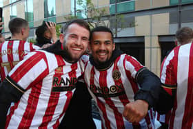 Ilman Ndiaye (right) with Sheffield United team mate Rhys Norrington-Davies during the club's promotion party: Paul Thomas /Sportimage