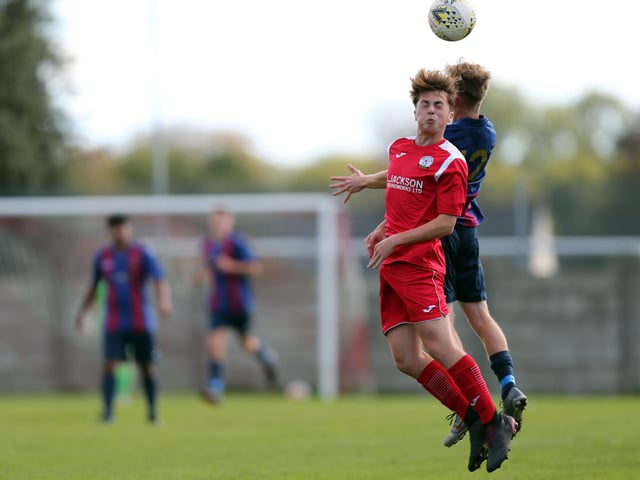 Max Innalls, left, and Toby Toman challenge for a header. Picture: Chris Moorhouse