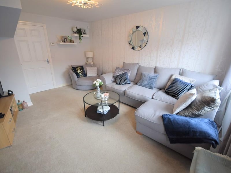 A stylish decorated front facing room having various power points, tv aerial point, central heating radiator, UPVC double glazed window and an internal door opens to an inner hallway with stairs rising to the first floor landing.