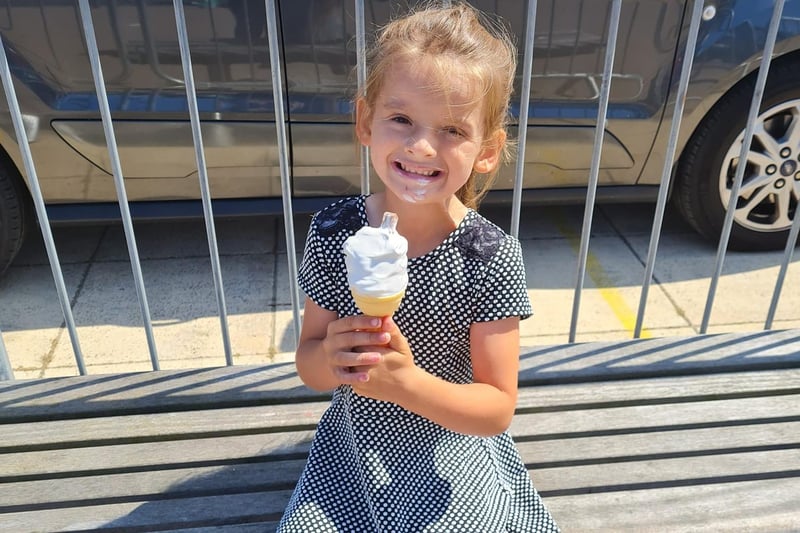 Six-year-old Phoebe tucks into her ice cream cornet.