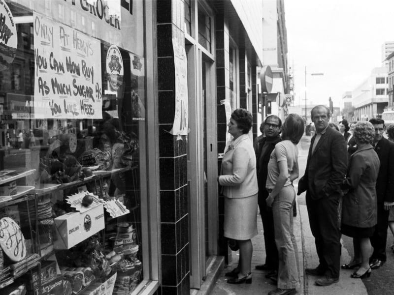 Glasgow shoppers queue at an Argyle Street grocers for sugar, available after the shortage of August 1974.