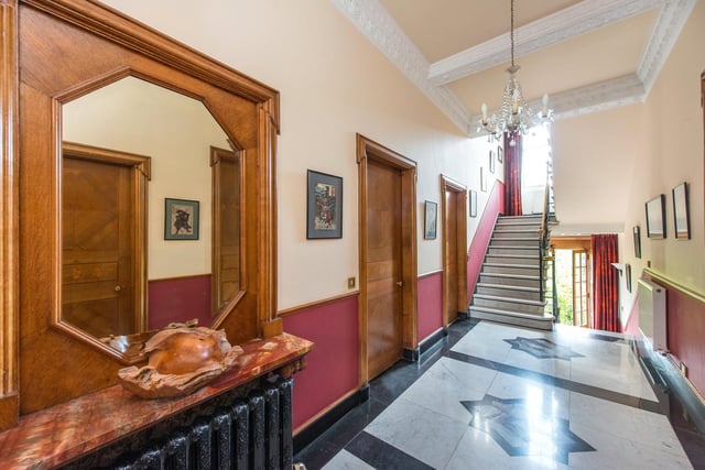 The house covers three floors, with wide staircases and Italian marble floors