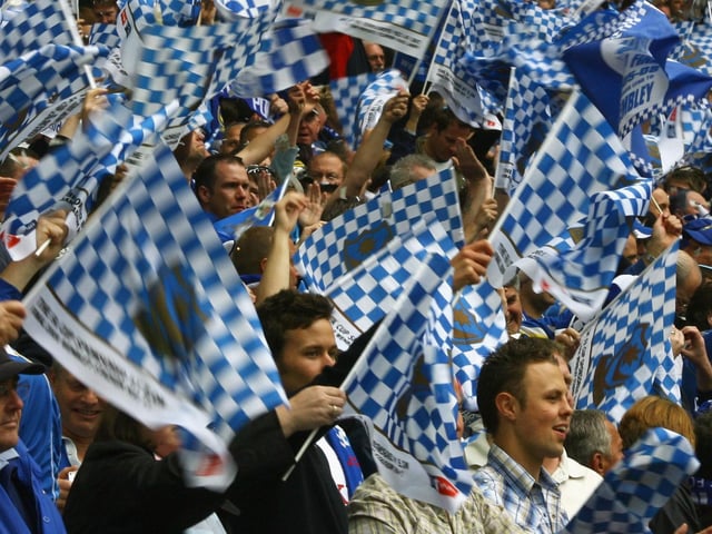 Pompey fans welcome out their team.