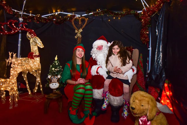 Father Christmas and his helper Amy Callaghan with 5-year-old Ava Davison were pictured in Santa's Grotto in The Place in the Park 5 years ago.