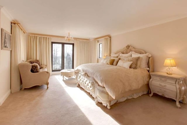 The galleried first-floor landing leads to a master suite including dressing room and high-quality full en suite bathroom. There are two further en suite bedrooms at this level and glorious views.
