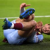 Aston Villa's Jack Grealish reacting to an injury. Neil Hall/PA Wire.