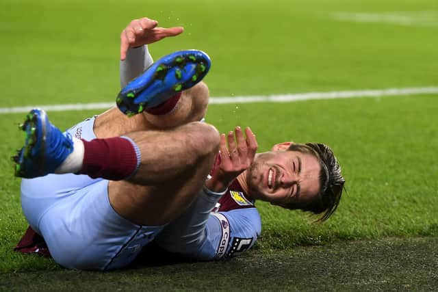 Aston Villa's Jack Grealish reacting to an injury. Neil Hall/PA Wire.