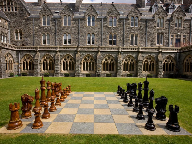 Enjoy a game of chess with a difference in the cloisters.