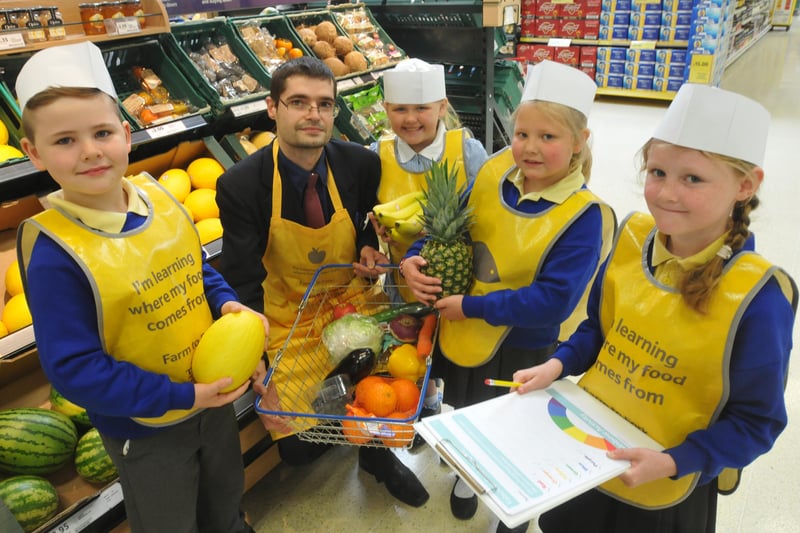 Pupils visited the Tesco Extra store in Newcastle Road in 2014 to join in the 'Farm to Fork' trail. Pictured with Michael Boyle customer assistant are Year 2 pupils Zac Schonewald, Rebecca Carter, Maddy Scott and Alisha Ord.