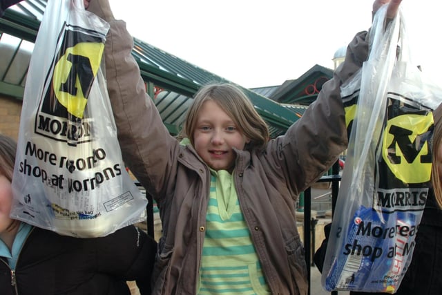Pictured at Hillsborough Morrisons supermarket, in 2007 where Jessica Helliwell is seen  with plastic carrier bags, with her mums shopping.