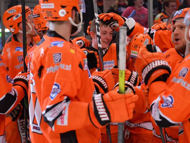 Alex Graham being mobbed by his Sheffield Steelers team mates. Pic: Dean Woolley