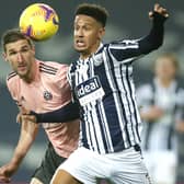 West Bromwich Albion's Callum Robinson, right, and Sheffield United's Chris Basham battle for the ball. (Andrew Boyers/Pool via AP)