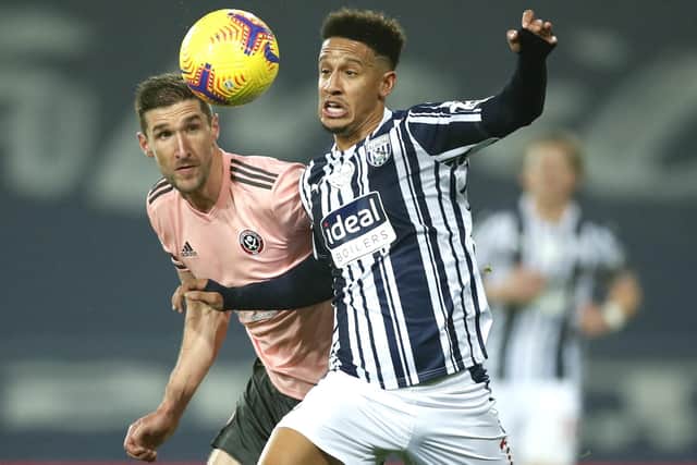 West Bromwich Albion's Callum Robinson, right, and Sheffield United's Chris Basham battle for the ball. (Andrew Boyers/Pool via AP)