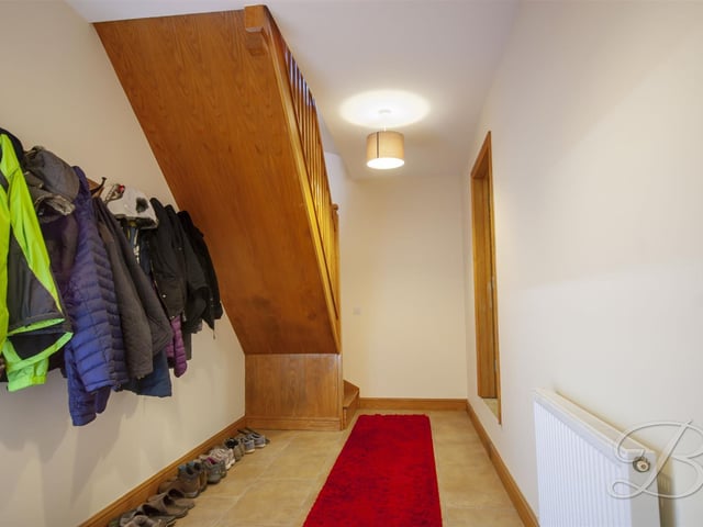 The basement hallway, giving access to the main house from the integral garage.