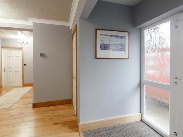Another look at the hall, which features a large hatch, with ladder attached, to the loft, which is a fully boarded space, with power and light points and velux roof light. There is also an airing cupboard housing the hot water cylinder and a new Worcester Bosch gas central heating boiler, installed only last April.