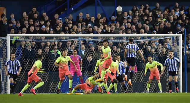 Jacob Murphy attempts a header at goal during the FA Cup fifth round tie between Sheffield Wednesday and Manchester City at Hillsborough Stadium. (Photo by PAUL ELLIS/AFP via Getty Images)