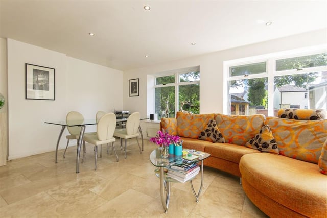 The family room, part of the open-plan kitchen, has space for a dining table and is a place to relax after mealtimes.