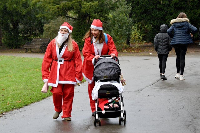 People of all ages were invited to walk or run the half-mile course dressed as Santa.