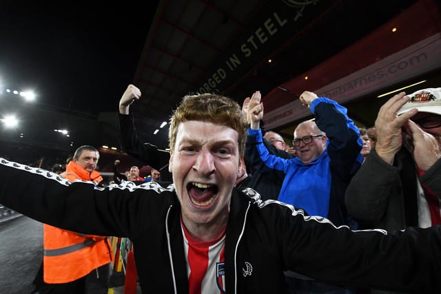 Sunderland fans celebrate their team's first goal during the Carabao Cup Third Round match between Sheffield United and Sunderland at Bramall Lane.