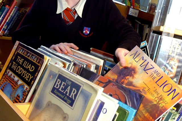 Edenthorpe Hungerhill School pupil Chelsea Dutton, aged 13, selecting a book for World Book Day in 2007